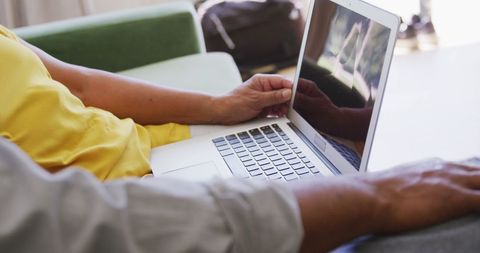 Senior Couple Relaxing Together with Laptop on Sofa at Home - Download Free Stock Images Pikwizard.com