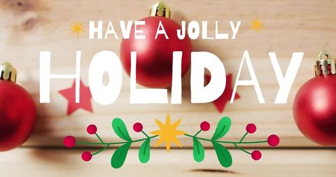 Have jolly holiday hand-lettered greeting with red christmas baubles on rustic wood planks