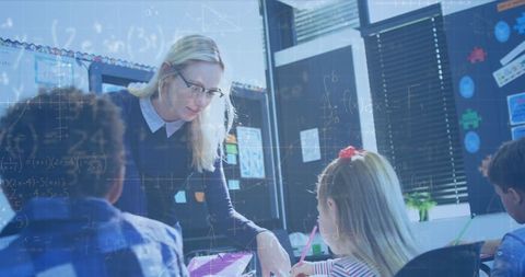 Teacher guiding diverse children with mathematical concepts in classroom