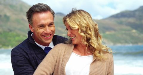Joyful Middle-Aged Couple Embracing Outdoors with Scenic View - Download Free Stock Images Pikwizard.com