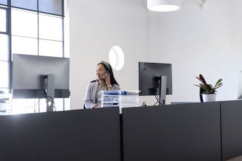 Businesswoman Engaged in Office Work in Modern Corporate Environment