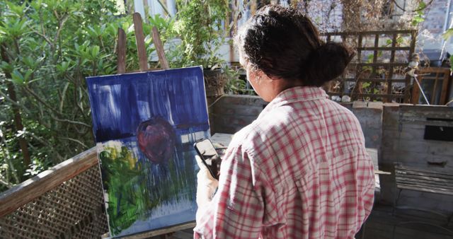 Woman Painting Abstract Art on Canvas Outdoors - Download Free Stock Images Pikwizard.com