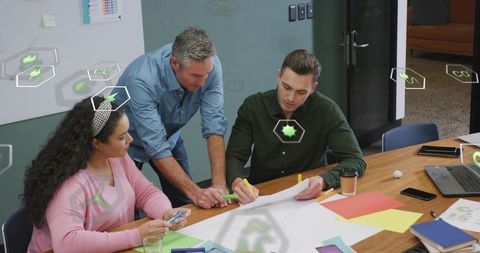 Team collaborating and sketching product concepts during brainstorming session