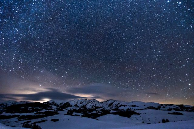 Starry Night Sky Over Snow-Covered Mountain Peaks - Download Free Stock Photos Pikwizard.com
