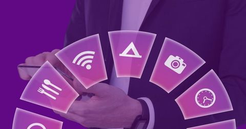 Businesswoman using digital tablet with travel icons overlay