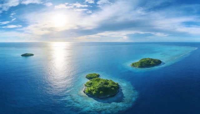 Tropical island aerial panorama with turquoise reefs and sunlit lagoon waters