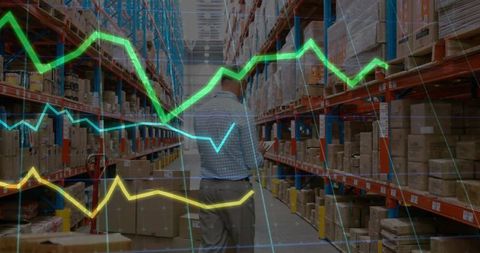 Warehouse Worker Using Scanner Amid Digital Graphs of Inventory Data