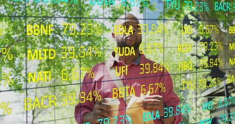 Man Holding Coffee Beneath Digital Stock Ticker in Green Urban Area