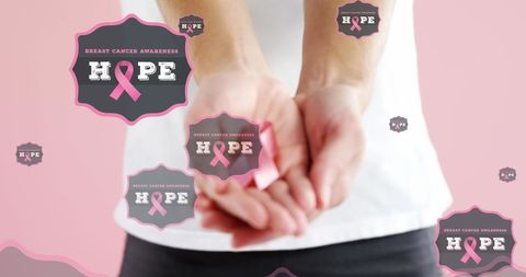 Woman Holding Pink Ribbon for Breast Cancer Awareness and Hope