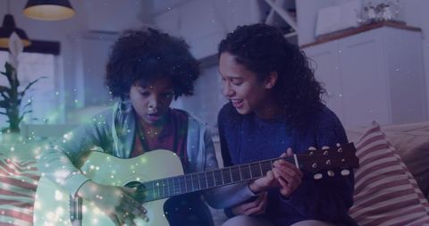 Joyful Mother Guiding Child in Guitar Playing with Magical Glow Effect
