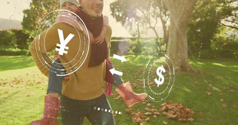 Father Carrying Child Piggyback in Park Showing Yen and Dollar Currency Exchange Overlay