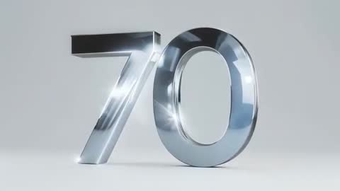Rotating Chrome Numeral 70 Reflecting Moving Light Glints on Minimal Gray Studio Floor