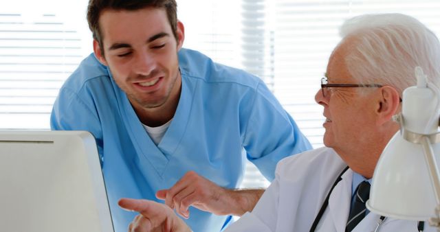 Young Nurse and Senior Doctor Collaborating in a Medical Office - Download Free Stock Images Pikwizard.com