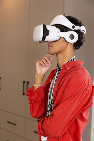 Man with VR Headset Experiencing Futuristic Technology
