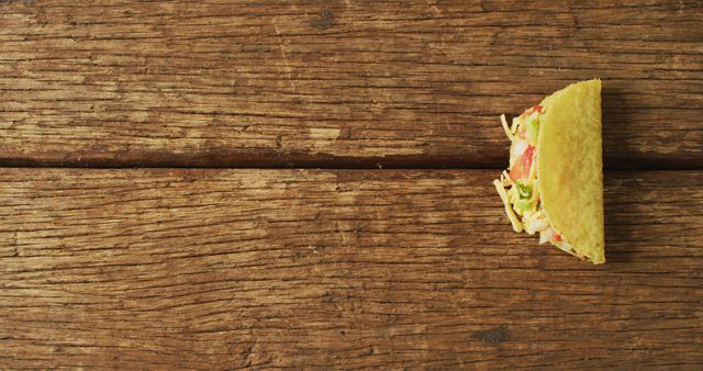 Delicious Half Taco on Rustic Wooden Table - Download Free Stock Images Pikwizard.com