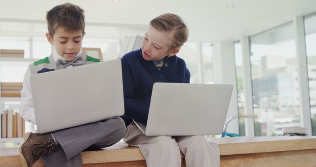 Children Collaborating on Laptops in Bright Modern Space - Download Free Stock Images Pikwizard.com