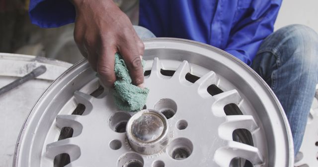 Mechanic Cleaning Car Alloy Wheel with Cloth - Download Free Stock Images Pikwizard.com