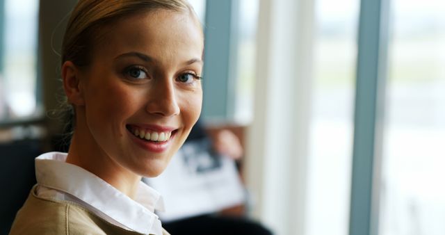 Beautiful woman smiling at airport - Download Free Stock Photos Pikwizard.com