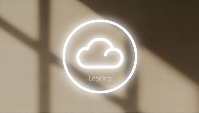 Glowing cloud loading icon projecting on beige wall with sunlight shadows minimal ui