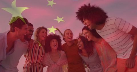 Group of Friends Celebrating Outdoor Life Under Red Sky