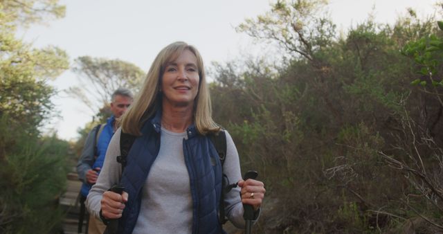 Smiling Woman Hiking on Sunnypath with Scenic Background - Download Free Stock Images Pikwizard.com