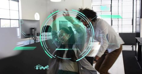 Asian woman shielding from turquoise ar hud analytics while colleague leans in open-plan office