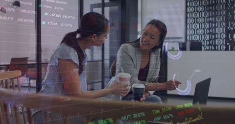 Business Analytics with Female Colleagues Collaborating in Office