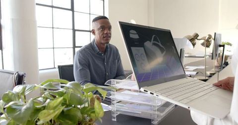 Team Collaboration Focused African American Man Office Discussion