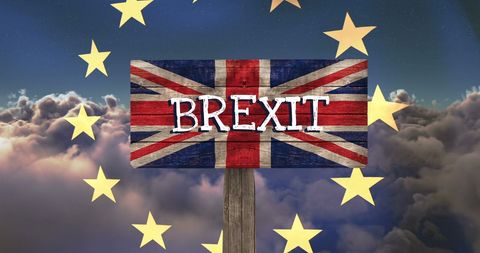 Brexit Sign with UK Flag Against EU Stars in Cloudy Sky