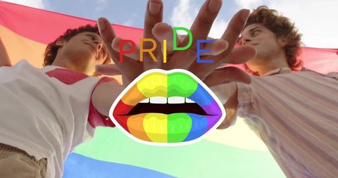 Two men celebrating pride holding rainbow flag with vibrant rainbow lips graphic