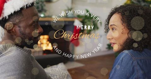 Festive Holiday Greetings with Happy Couple by Fireplace