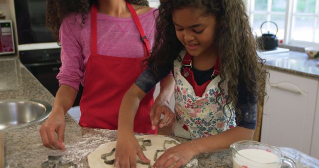 Mother and Daughter Bonding While Baking Cookies in a Warm Home Kitchen - Download Free Stock Images Pikwizard.com