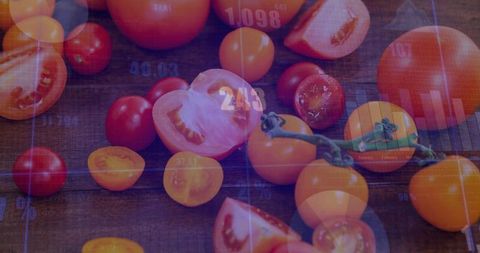 Assorted tomatoes on dark wood with data overlay blending produce and agricultural analytics