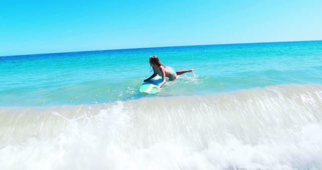 Excited young woman surfing in the sea on a sunny day 4k
