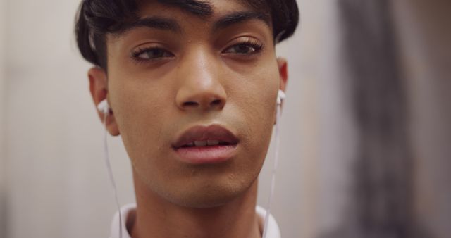 Close-Up of Young Man Wearing Earphones - Download Free Stock Images Pikwizard.com