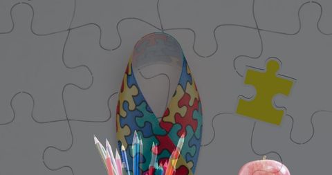 Autism awareness puzzle ribbon with school supplies