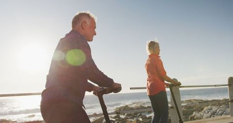 Joyful Seniors Riding Scooters on Sunny Promenade