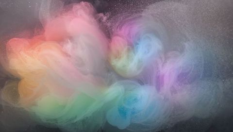Swirling pastel nebula: multicolored ink clouds creating ethereal gradient backdrop