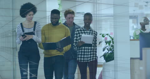 Diverse Team Collaborating with Digital Overlay in Office Environment