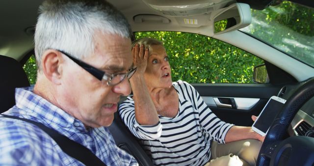 A senior Caucasian couple appears shocked or surprised while sitting in a car, with copy space. Their expressions suggest they may have witnessed something unexpected or are reacting to a sudden event on the road.