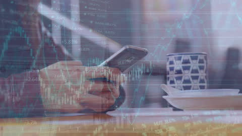 Finance and Technology: Hand Holding Smartphone with Data Overlay