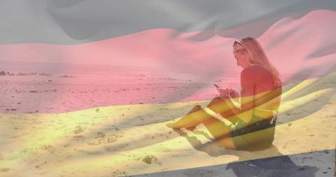Young woman texting on sunny beach with translucent flag overlay and copy space