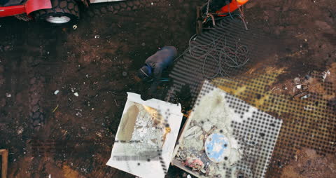 Aerial View of Junkyard with Rotating Globe Digital Overlay