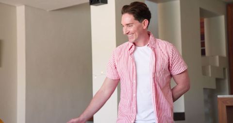 Joyful man proposing marriage at home with happiness