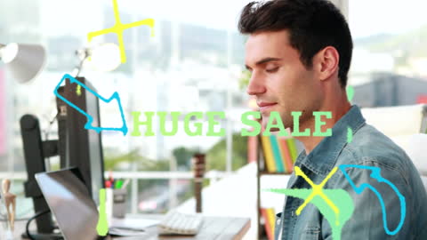 Businessman Using Computer With Huge Sale Overlay