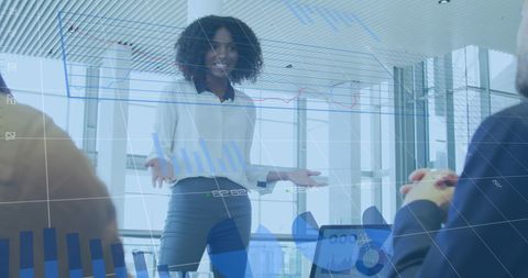 Diverse Businesswoman Presenting Financial Data in Modern Office