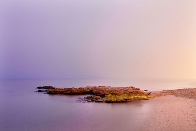 Serene Sunrise Over Tranquil Rocky Beach - Download Free Stock Images Pikwizard.com