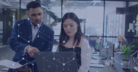 Diverse Team Analyzing Digital Data with Network Hologram in Modern Office