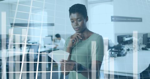 Woman Analyzing Financial Data in Modern Office Environment - Download Free Stock Images Pikwizard.com