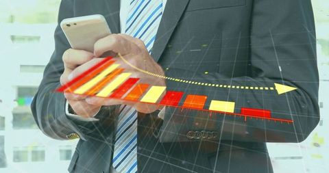 Holding phone while viewing augmented reality growth chart overlay in corporate office